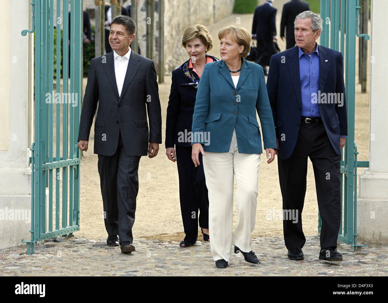 German Chancellor Angela Merkel (2-R), her husband Joachim Sauer (L