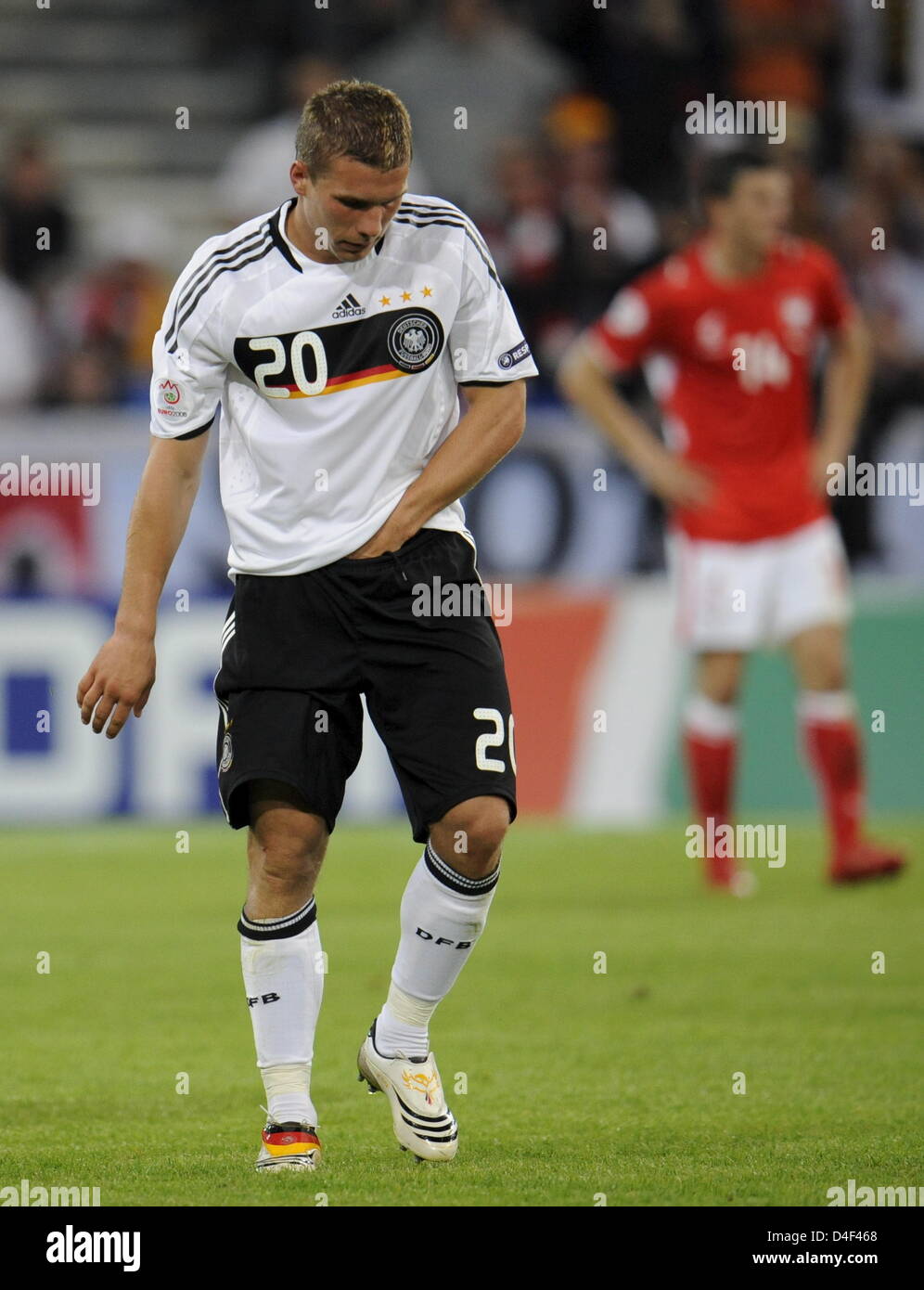 Lukas Podolski of Germany leaves the pitch after he received a kick between his legs by Dariusz Dudka (not pictured) during the EURO 2008 preliminary round group B match in Woerthersee Stadium, Klagenfurt, Austria, 08 June 2008. Photo: Peter Kneffel dpa +please note UEFA restrictions particularly in regard to slide shows and 'No Mobile Services'+ +++###dpa###+++ Stock Photo