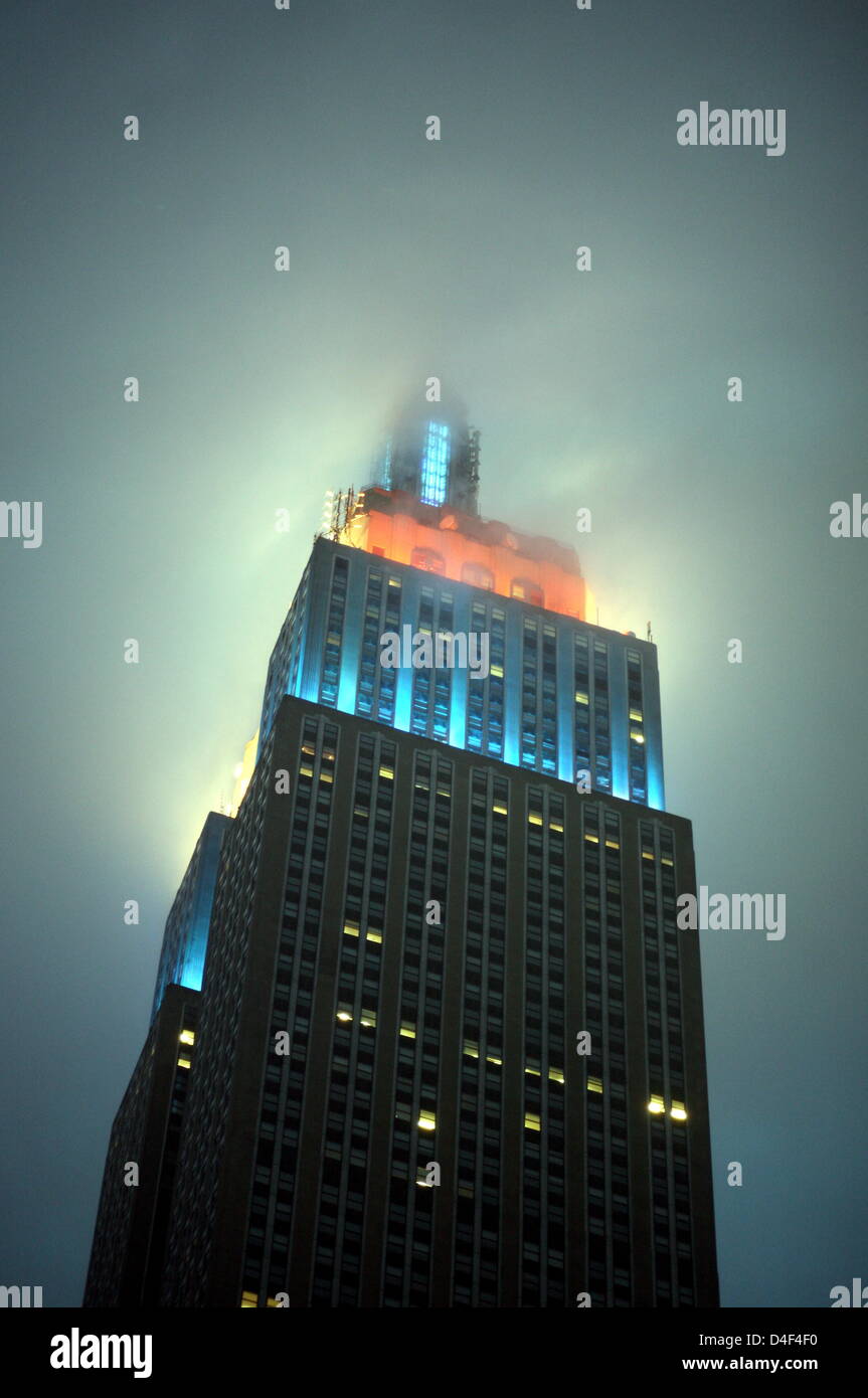The Empire State Building Is Covered In Clouds In Manhatten