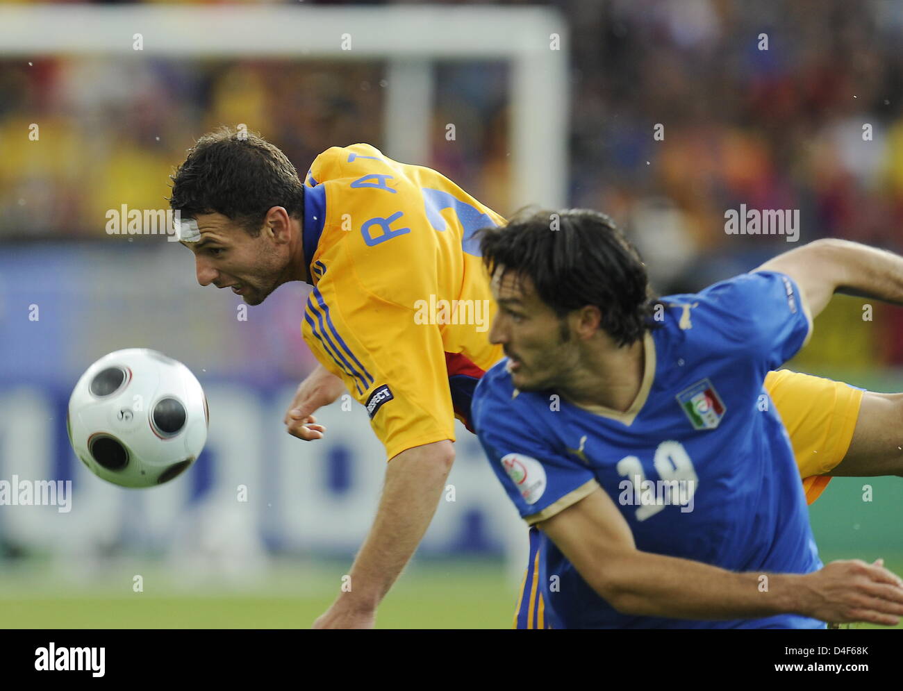 Slightly injured Razvan Rat of Romania (L) vies with Gianluca Zambrotta ...