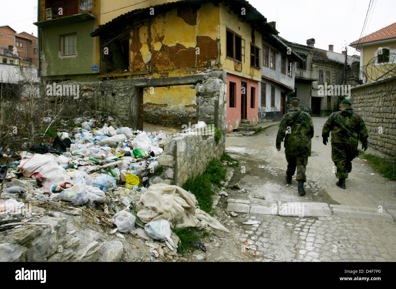 Two soldiers of German Bundeswehr patrol a street in Prizren, Kosovo ...