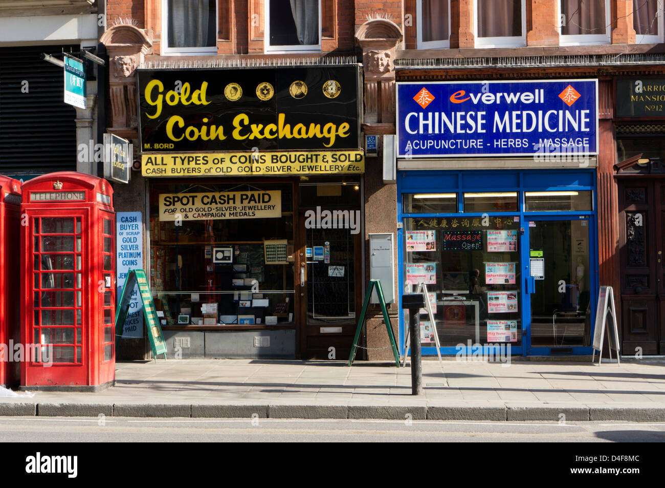 Gold Coin Exchange and Chinese Medicine premises in Charing Cross Road, London. Stock Photo