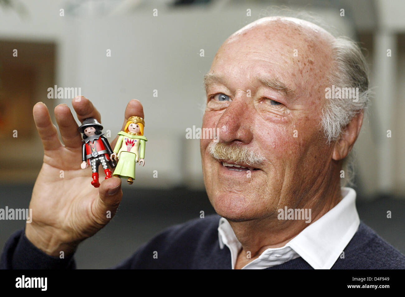 Founder and owner of Playmobil producer geobra Brandstaetter, Horst  Brandstaetter, poses with Playmobil figures in Zirndorf,