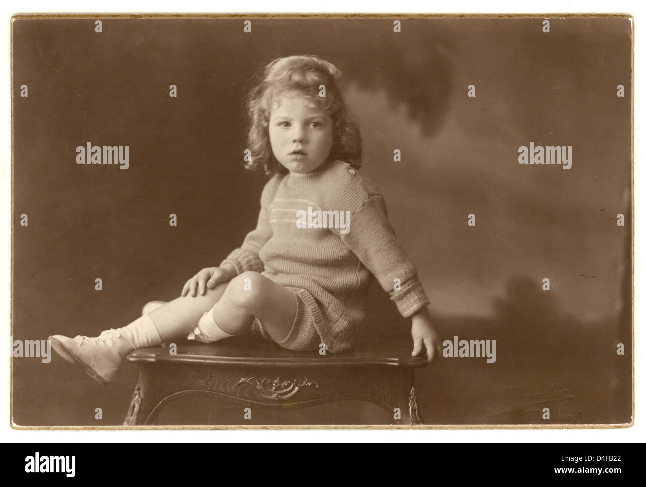 Studio portrait of young boy with curly long hair called Bernard, looking  at the camera, early 1920's, Brighton, Sussex, England,  Stock Photo -  Alamy