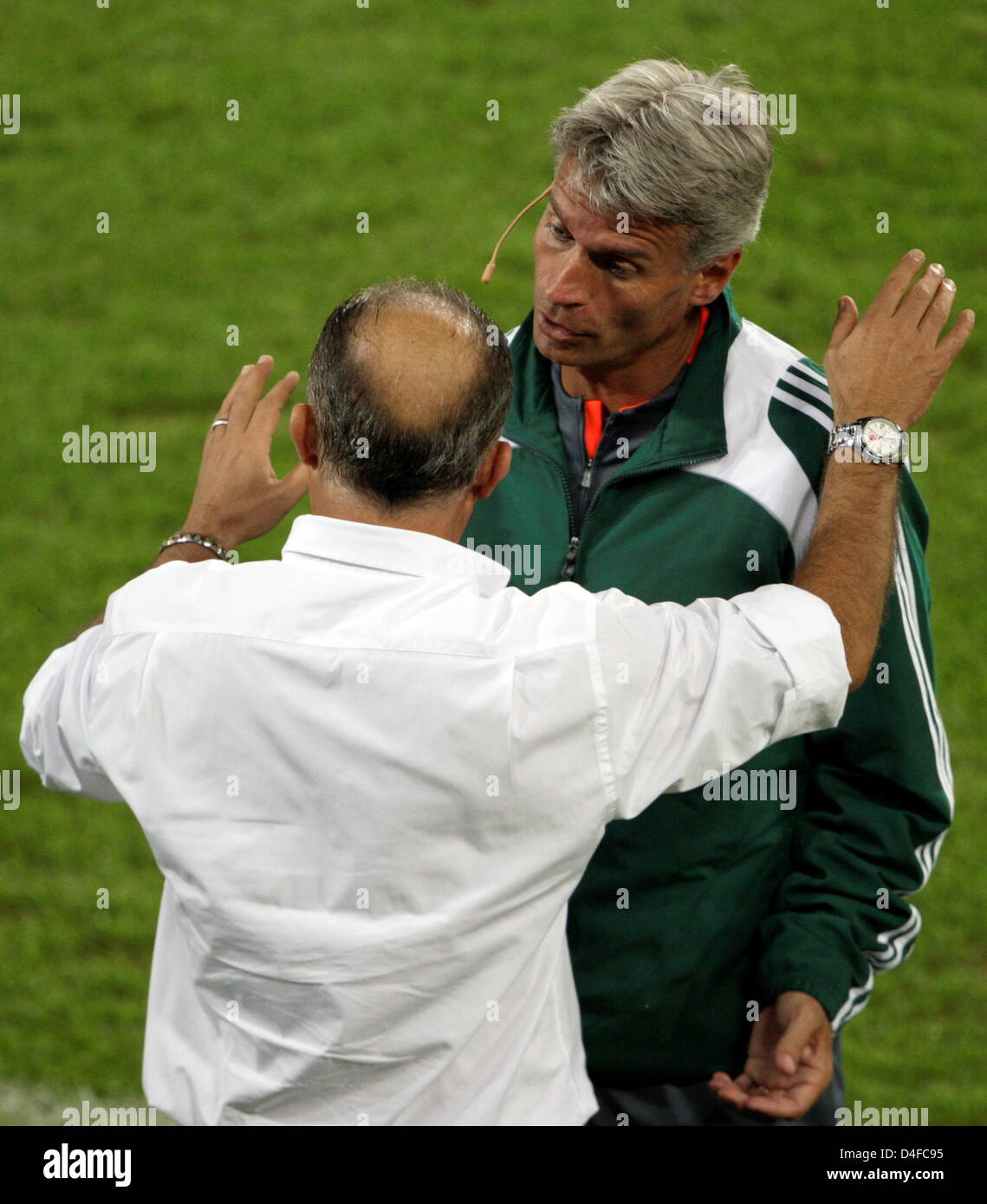 Turkish head coach Fatih Terim talks to the fourth official Peter Fröjdfeldt (R) from Sweden during the UEFA EURO 2008 semifinal match between Germany and Turkey at the St. Jakob-Park stadium in Basel, Switzerland, 25 June 2008. Photo: Oliver Berg dpa +please note UEFA restrictions particulary in regard to slide shows and 'No Mobile Services'+ +++(c) dpa - Bildfunk+++ Stock Photo