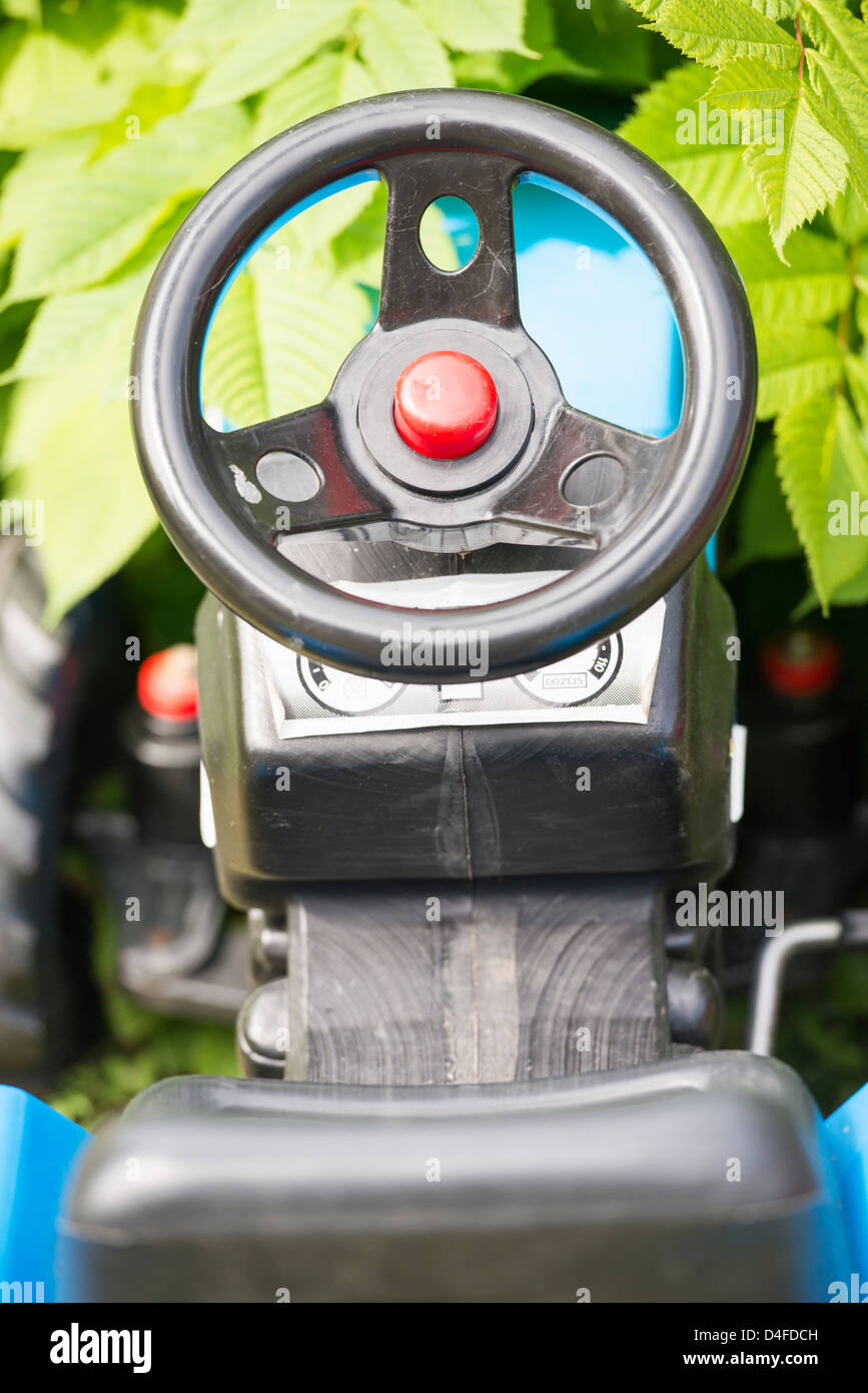 Steering wheel and seat of plastic toy car Stock Photo