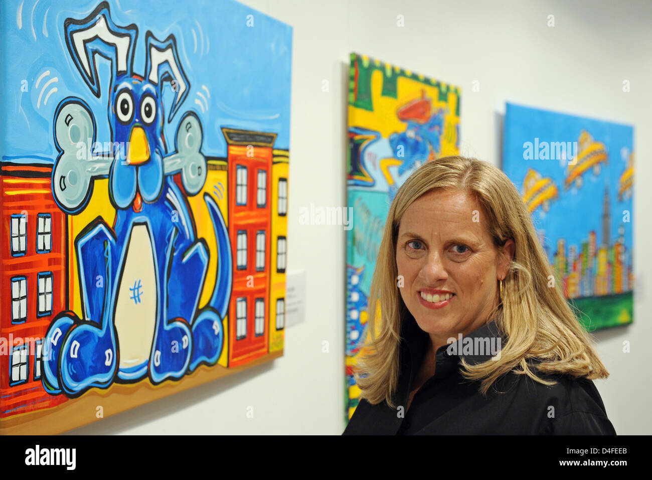US artist Lisa Grubb stands next to his painting 'Happy Dog' at the