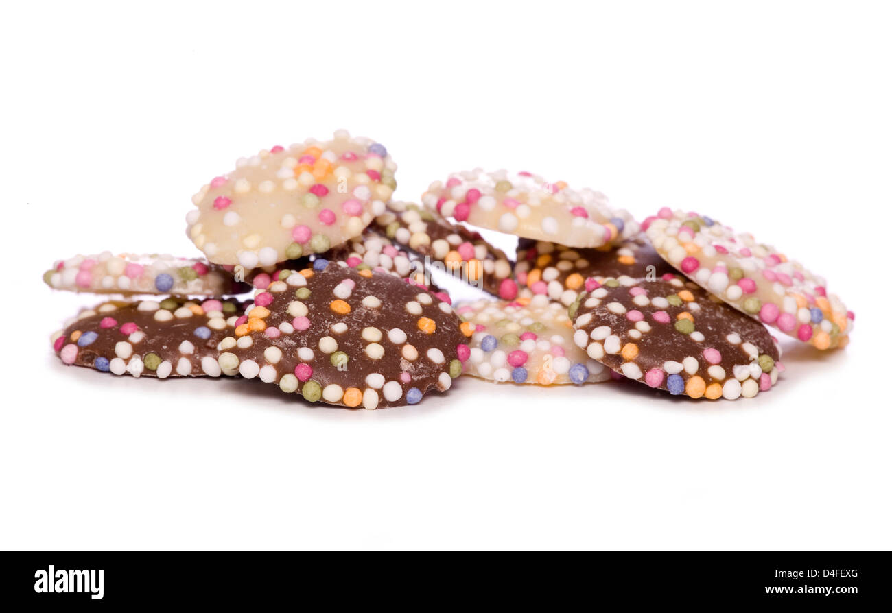 chocolate buttons with hundreds and thousands cutout Stock Photo
