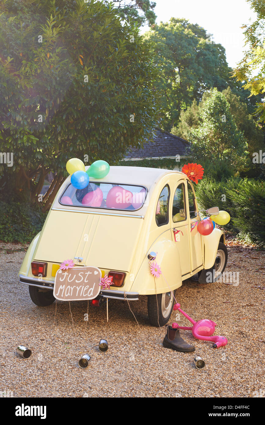 Newlywed's car decorated with balloons Stock Photo