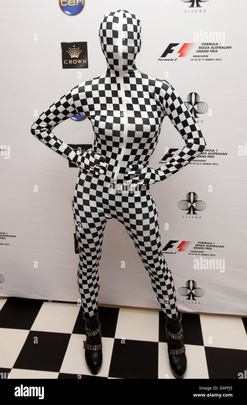 A Person in Black Zentai Suit Lying on a White Surface · Free Stock Photo