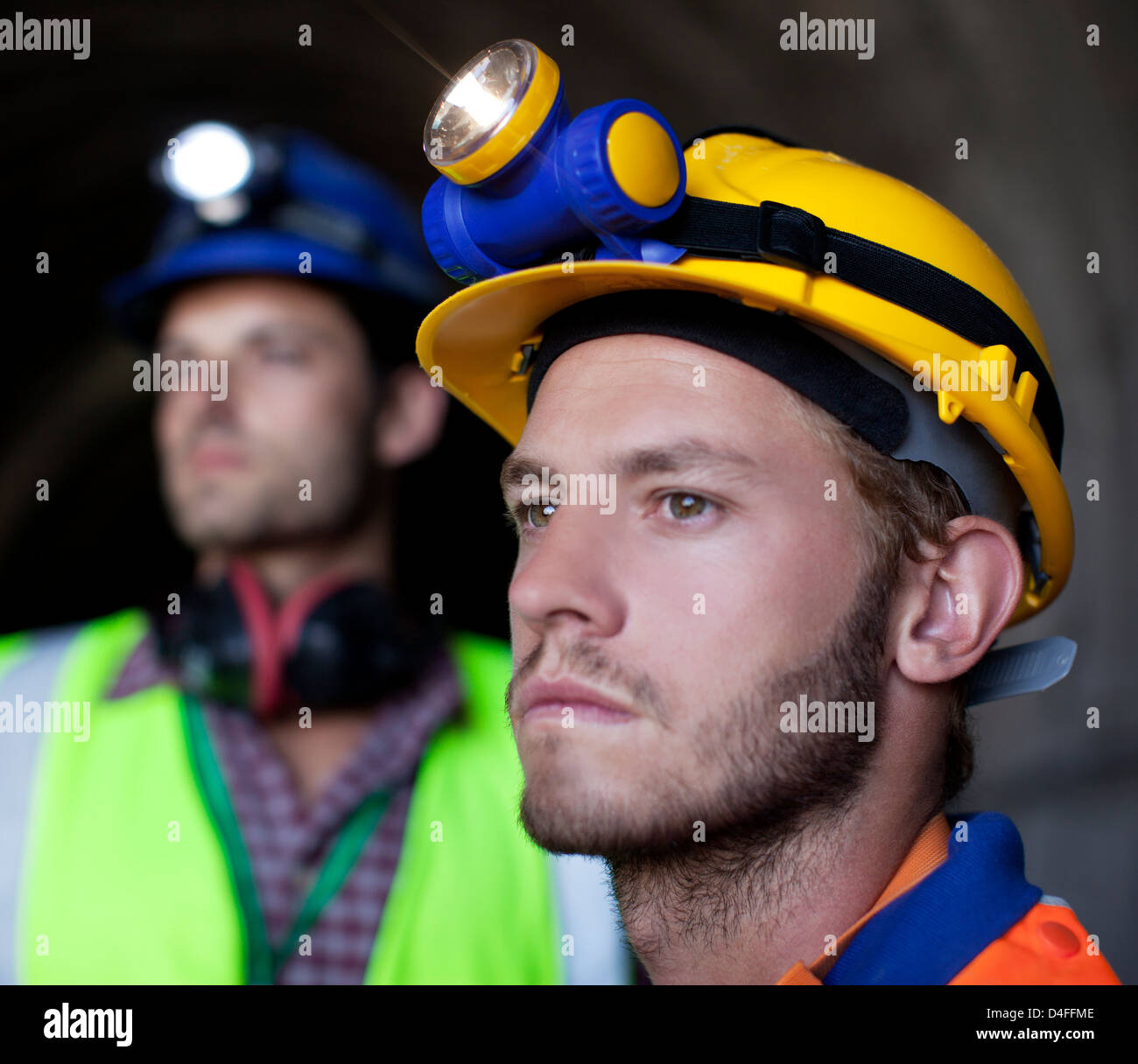 Close up of worker's face in tunnel Stock Photo
