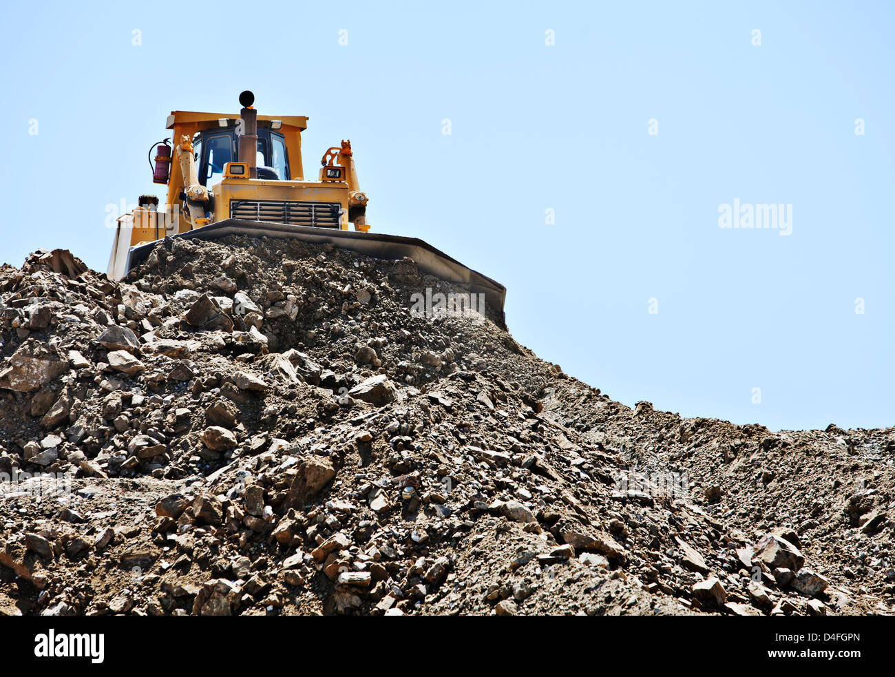 Bulldozer working in quarry Stock Photo