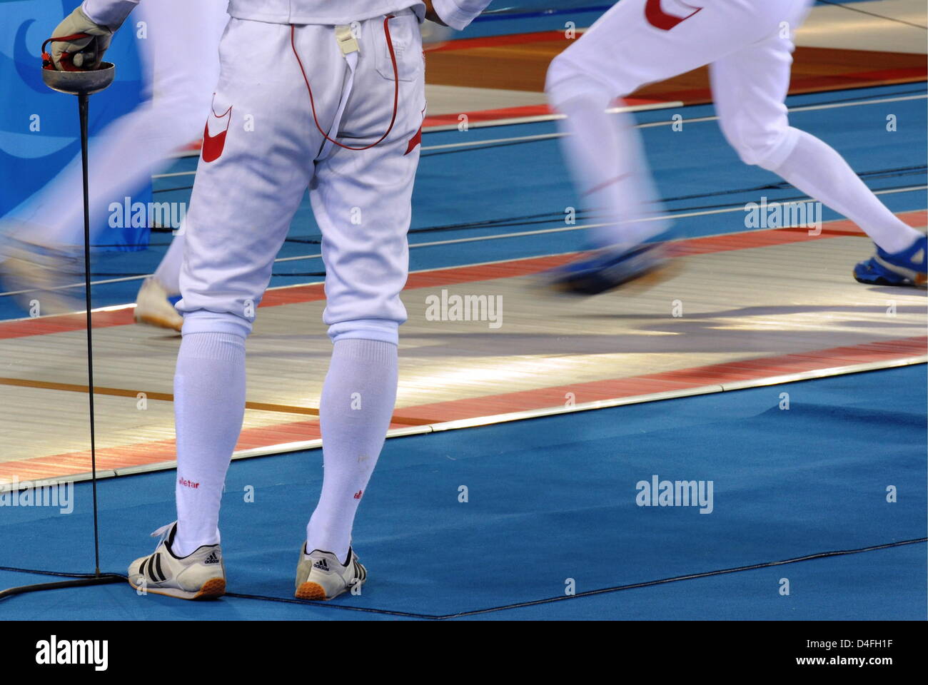 Fencers seen during a practice session in the Fencing Hall of the
