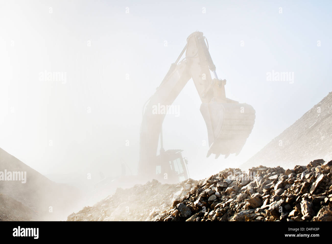 Digger working in quarry Stock Photo