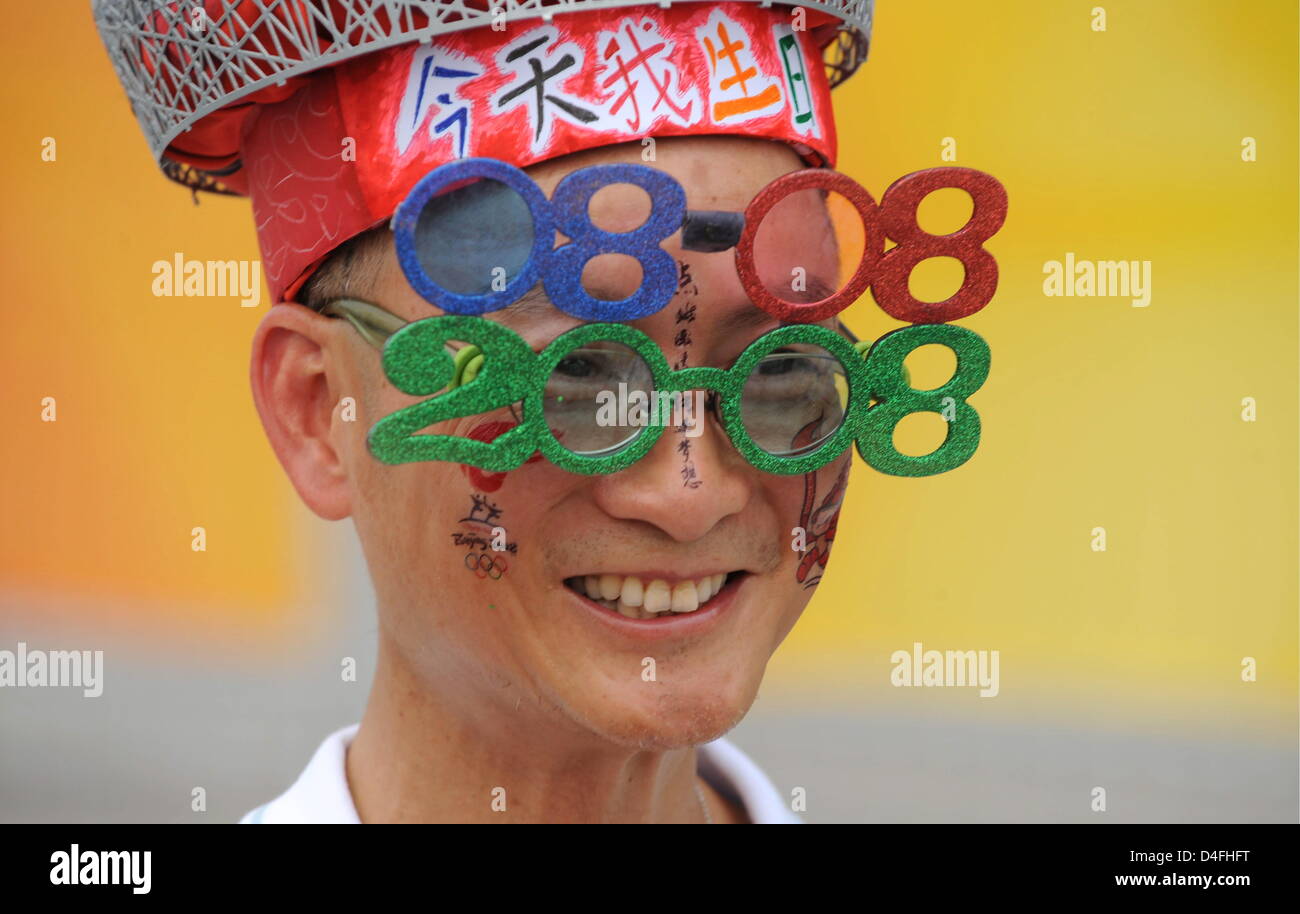 A chinese supporter wearing funny glasses showing the actual date