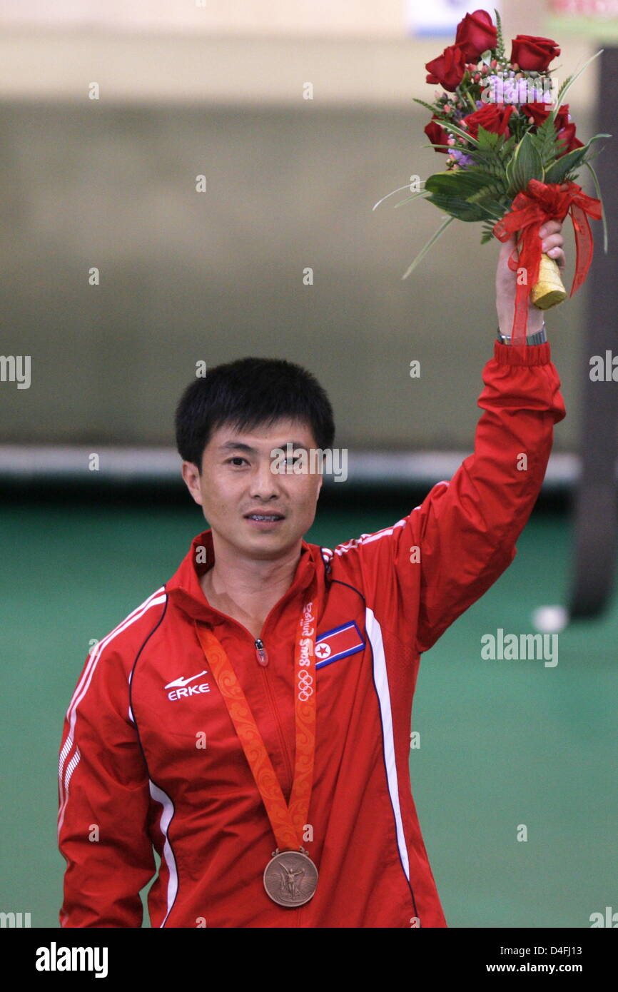 Bronce medal winner Jong Su Kim from North Korea during the medal ceremony in the men`s 10m air pistol qualification in the Beijing Shooting Range Hall at the Beijing 2008 Olympic Games, Beijing, China, 09 August 2008. Photo: Jens Buettner dpa (c) dpa - Bildfunk Stock Photo