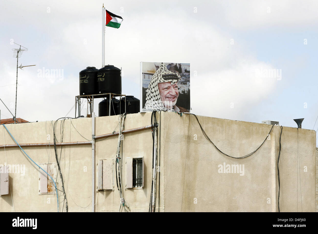 A portrait of former Palestine leader Yasser Arafat on the roof of his last residence in Ramallah, Palestinian Autonomous Territories, 27 February 2008. Yasser Arafat, also referred to as 'Abu Ammar', had served as Chairman of the Palestine Liberation Organisation (PLO) for decades and as President of the Palestinian National Authority (PA) before he died aged 75 on 11 November 200 Stock Photo