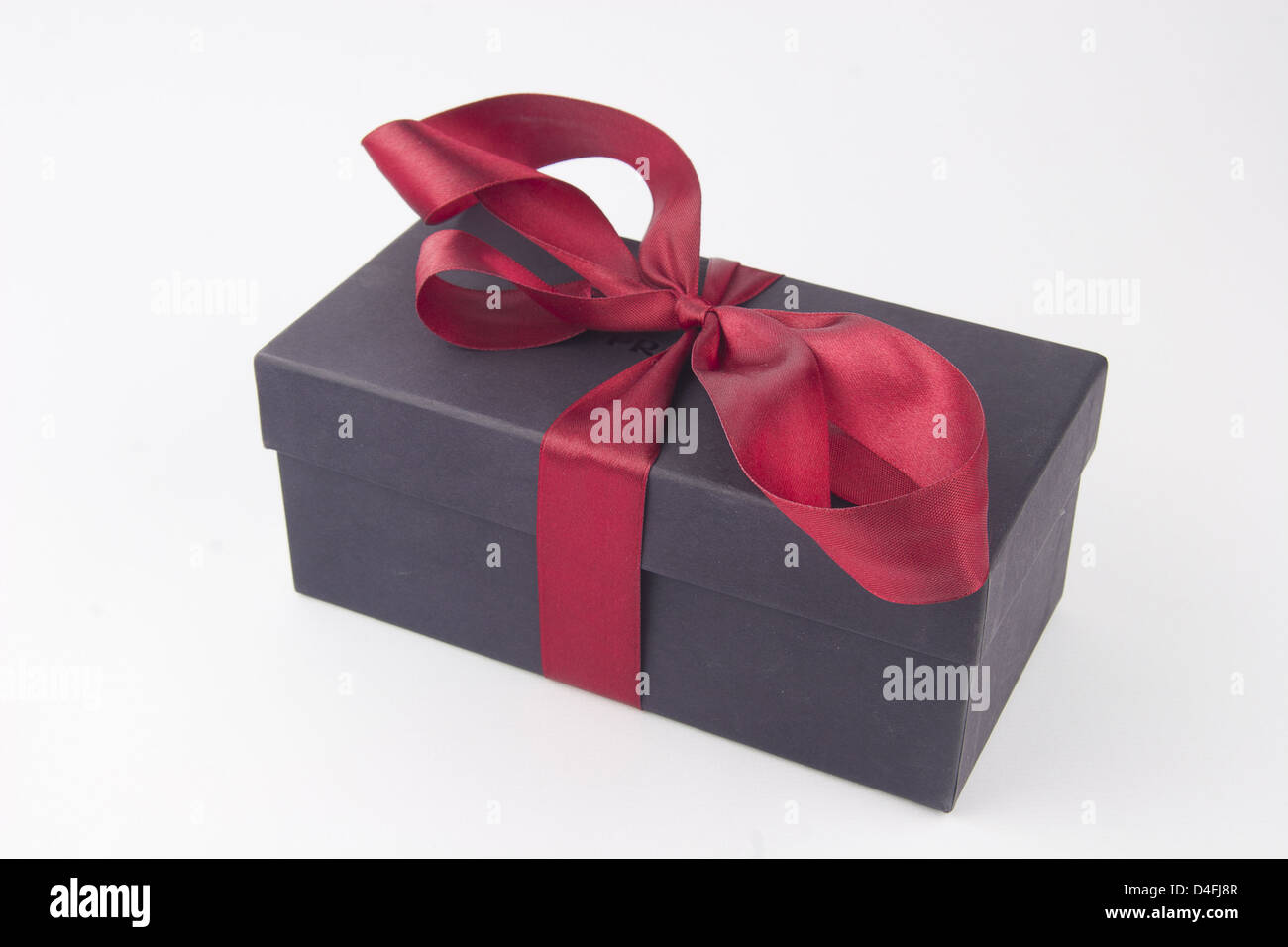 Gift box with a red bow and ribbon Stock Photo - Alamy