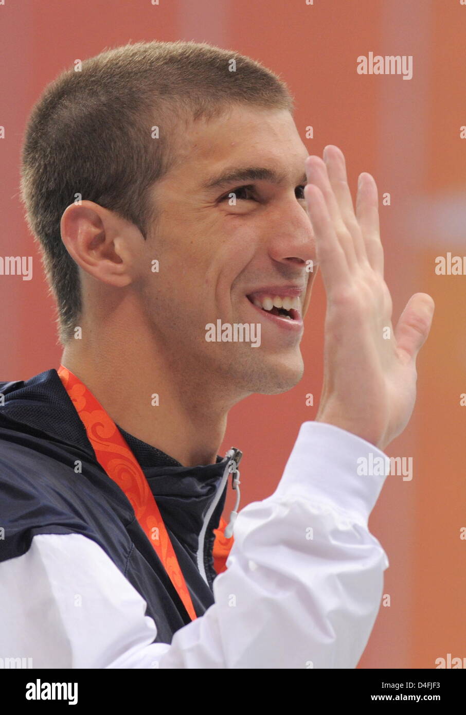 Goldmedallist Michael Phelps celebrates on the podium during the medal ceremony for the men's 400 M individual medley during the 2008 Olympics at the National Aquatics Center in Beijing, China 10 August 2008. Photo: Bernd Thissen dpa (c) dpa - Bildfunk Stock Photo