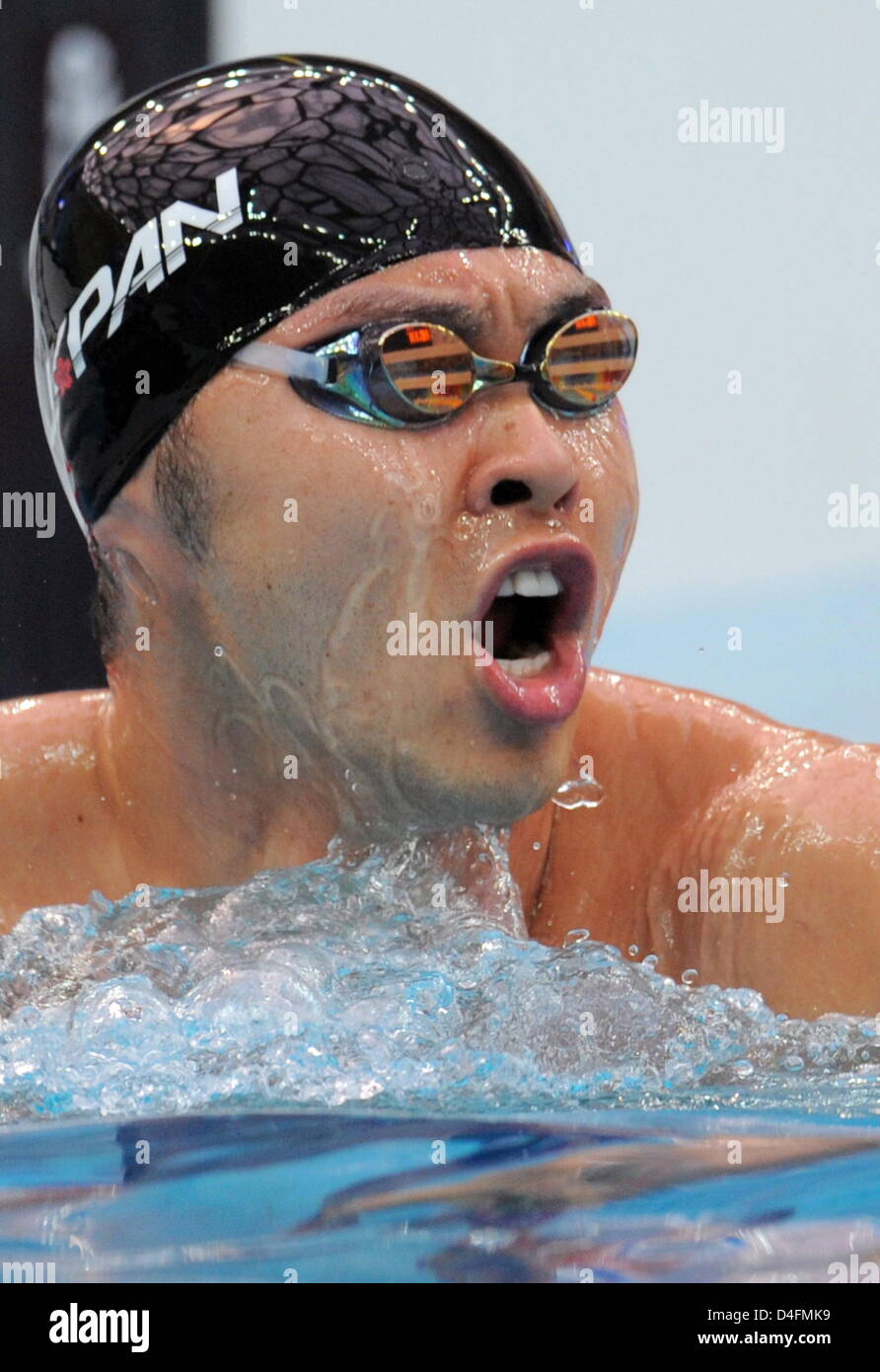 Kosuke Kitajima of Japan reacts after winning gold in an Olympic record