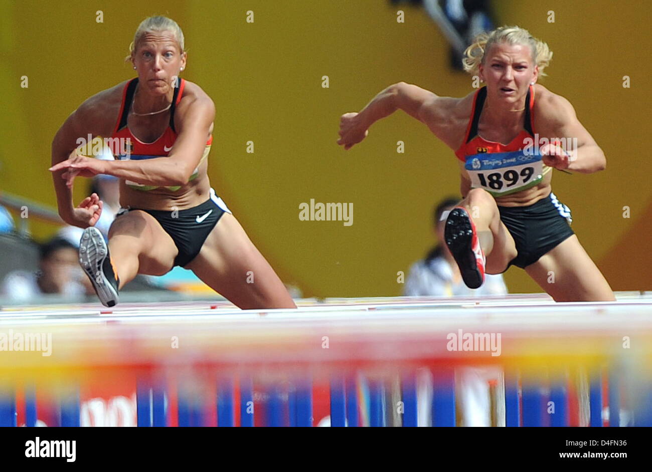 German Jennifer Oeser (L) and Lilli Schwarzkopf (R) compete in the women's heptathlon 100m hurdles of the Athletics events in the National Stadium at the Beijing 2008 Olympic Games, Beijing, China, 15 August 2008. Photo: Karl-Josef Hildenbrand dpa (c) dpa - Bildfunk Stock Photo