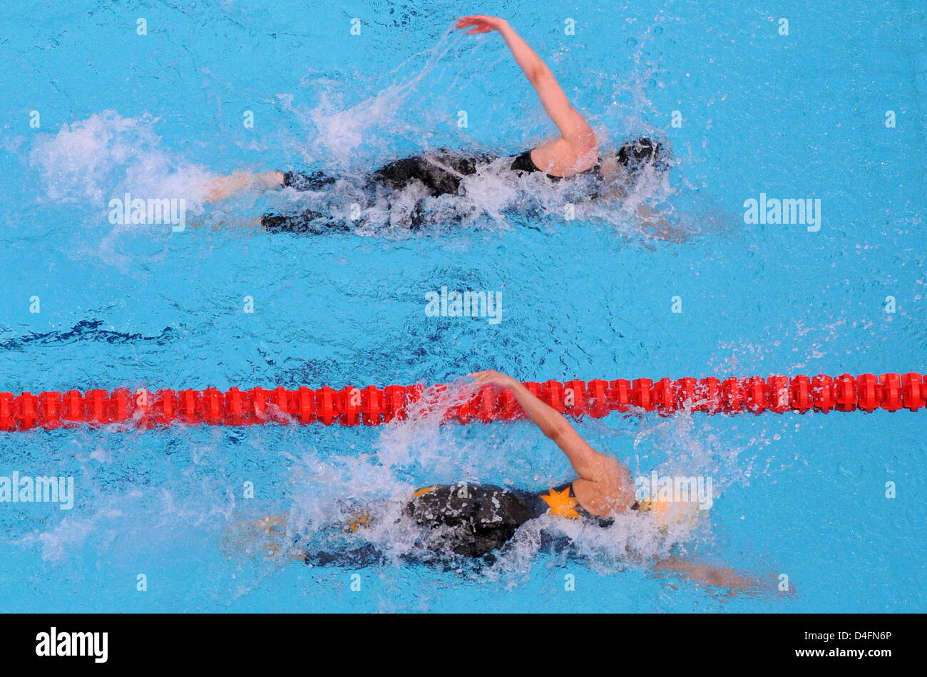 Britta Steffen from Germany (top) competes against Lisbeth Trickett from Australia during the women's swimming 100m freestyle final at the Beijing 2008 Olympic Games in Beijing China, 15 August 2008. Steffen won in 53.12 seconds and set up a new olympic record. Photo: Bernd Thissen dpa ###dpa### Stock Photo