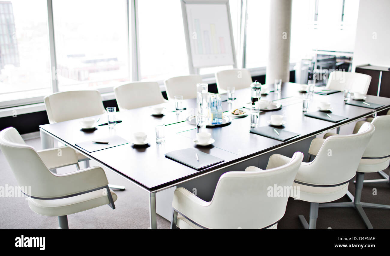 Table set for meeting in office Stock Photo - Alamy