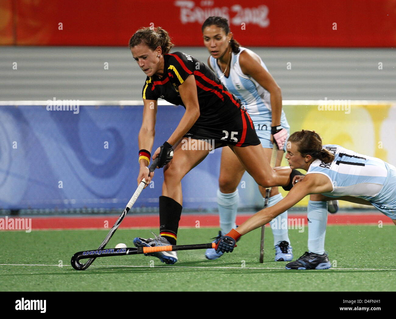 Janne Mueller-Wieland (L) of Germany vies with Agustina Gonzalez (C) and Carla Rebecchi (R) of Argentina during the womenÒs hockey preliminary match W21 between Germany and Argentina competition at the Beijing 2008 Olympic Games, Beijing, China, 16 August 2008. Photo: Marcus Brandt dpa ###dpa### Stock Photo