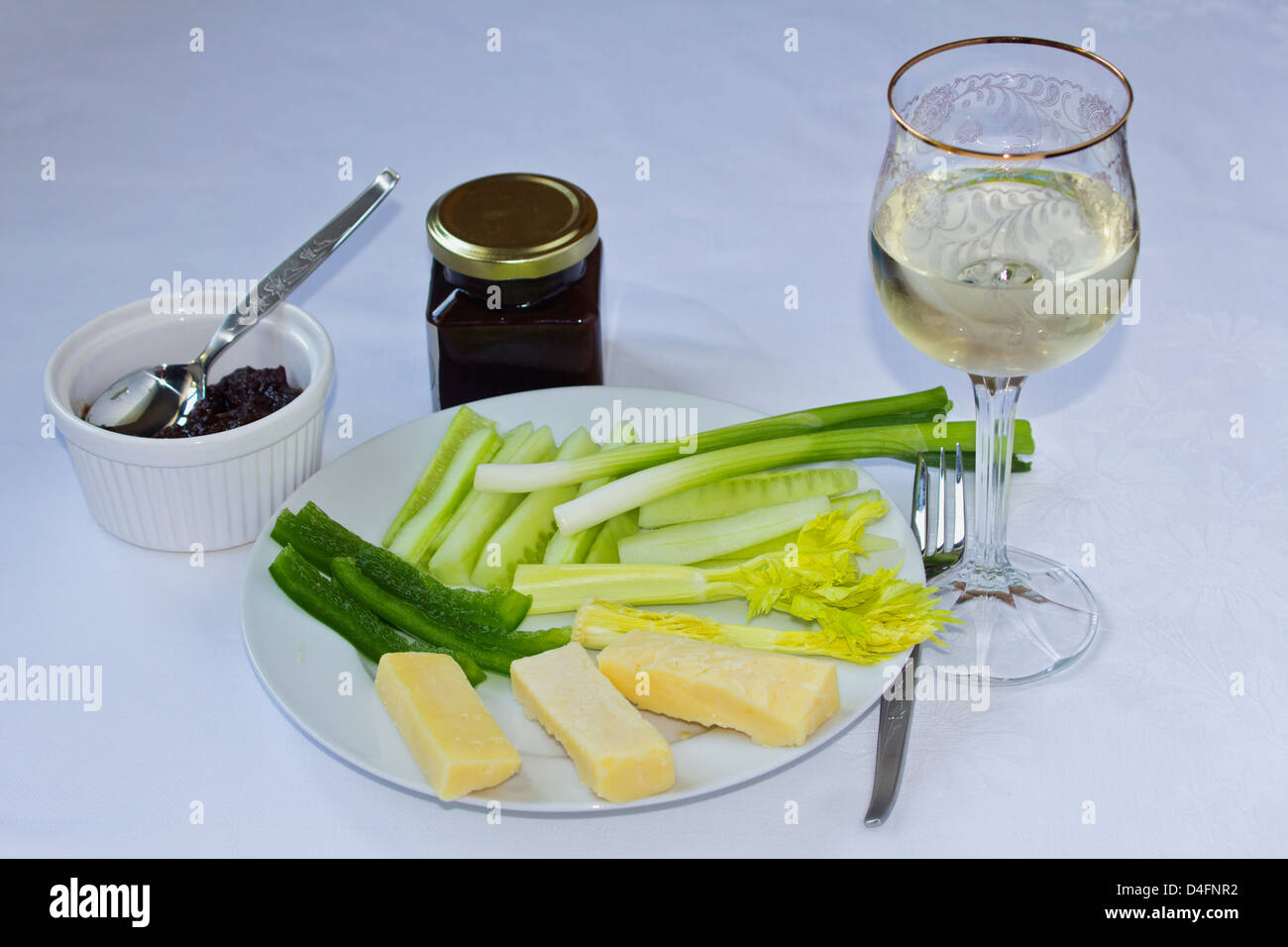 Cheese and vegetable snack with glass of wine Stock Photo