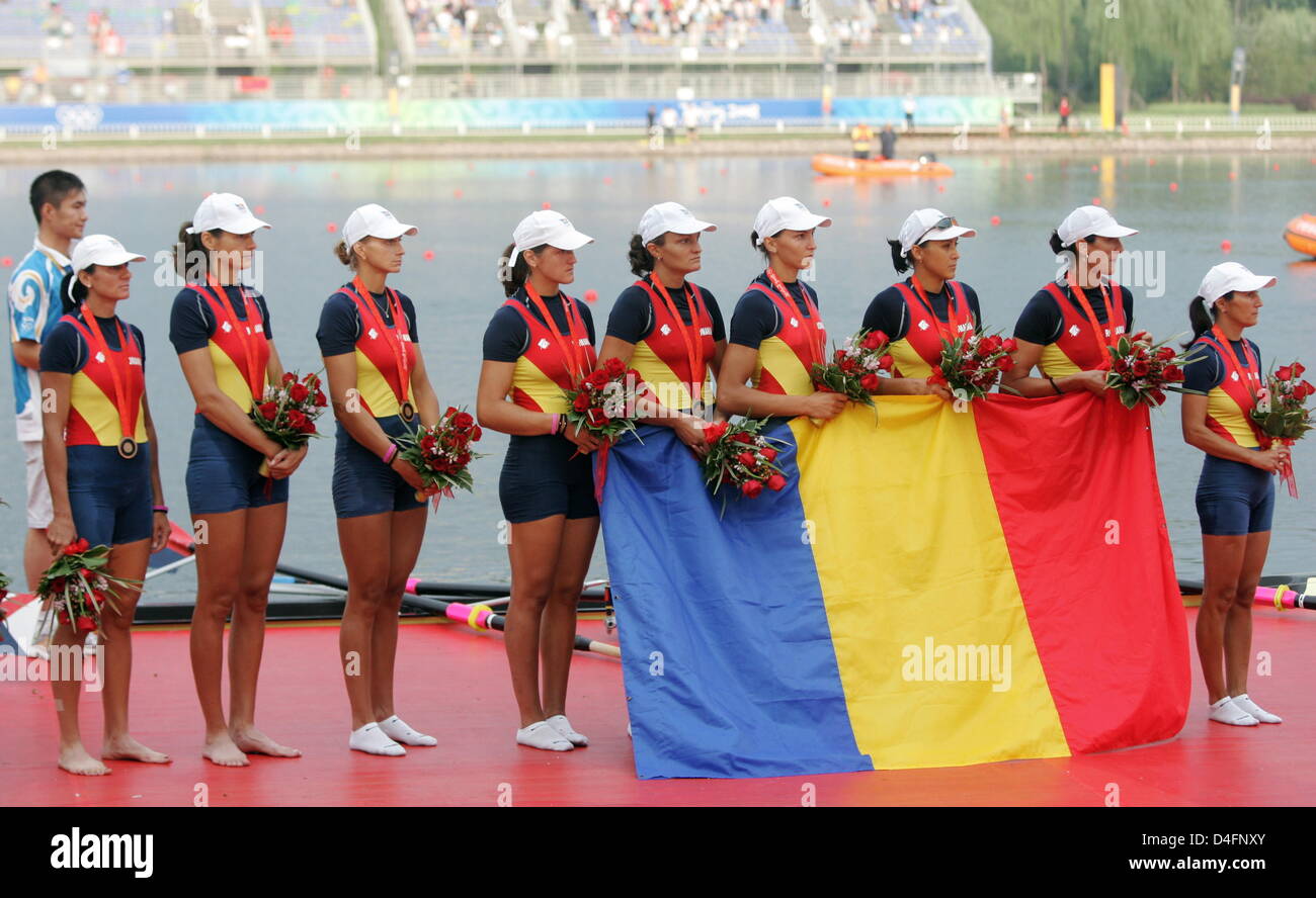 Women`s eight from Rumania celebrate theor bronze medal on the podium ...