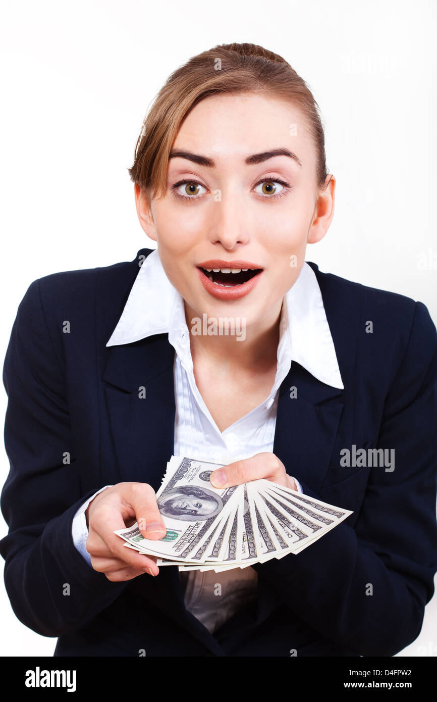 Portrait of excited young woman holding money in the hand on white ...