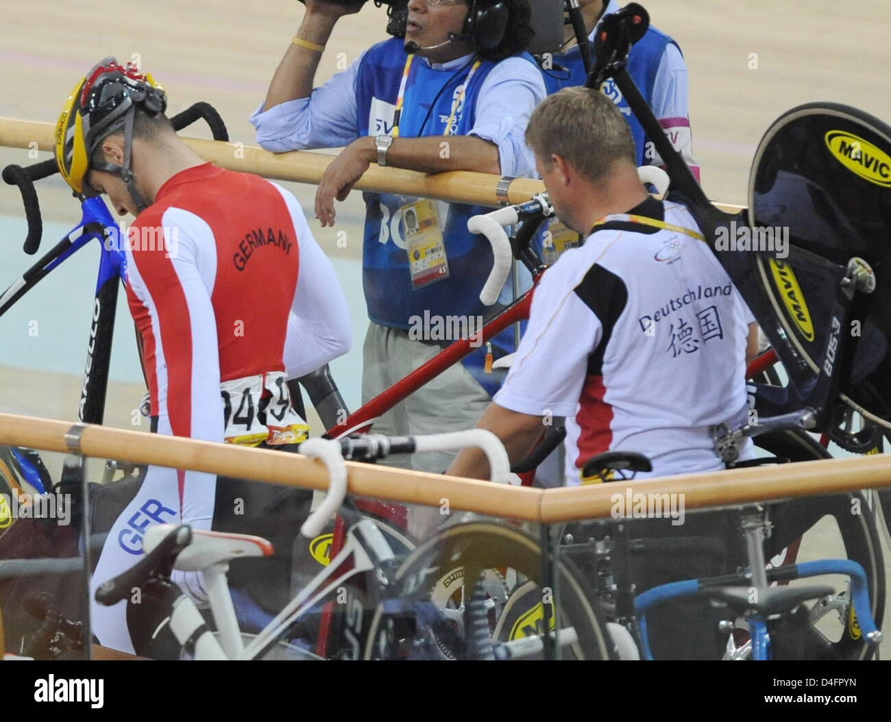 Maximilian Levy (L) of Germany leaves the track after the Men's Sprint Semifinal in the Cycling - Track competition at Laoshan Velodrome at the Beijing 2008 Olympic Games, Beijing, China, 19 August 2008. Photo: Peer Grimm dpa ###dpa### Stock Photo