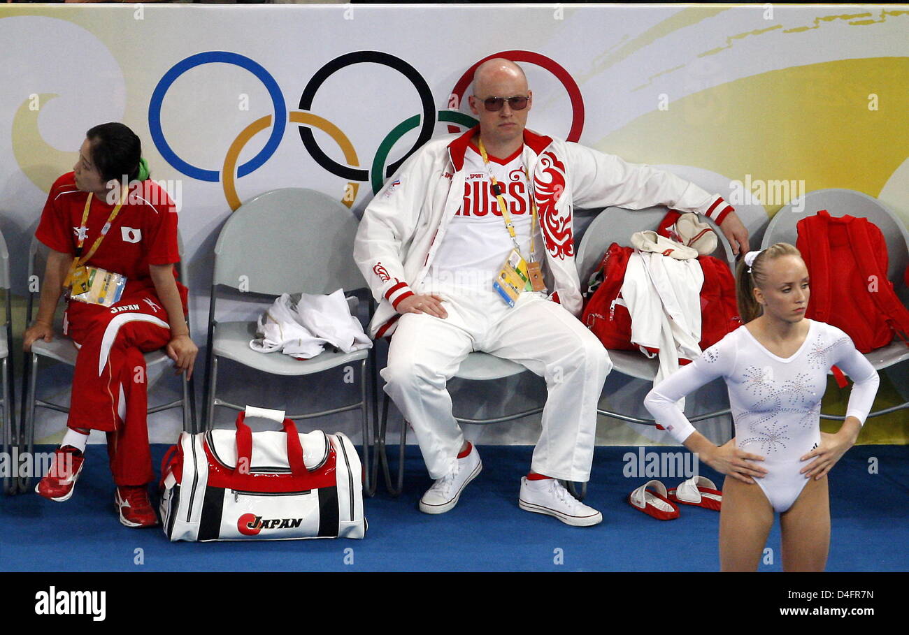 A russian coach watches Nastia Liukin (R) of the USA exercising in the Women's Beam Final in the National Indoor Stadium during the Beijing 2008 Olympic Games in Beijing, China, 19 August 2008. Photo: Marcus Brandt dpa ###dpa### Stock Photo