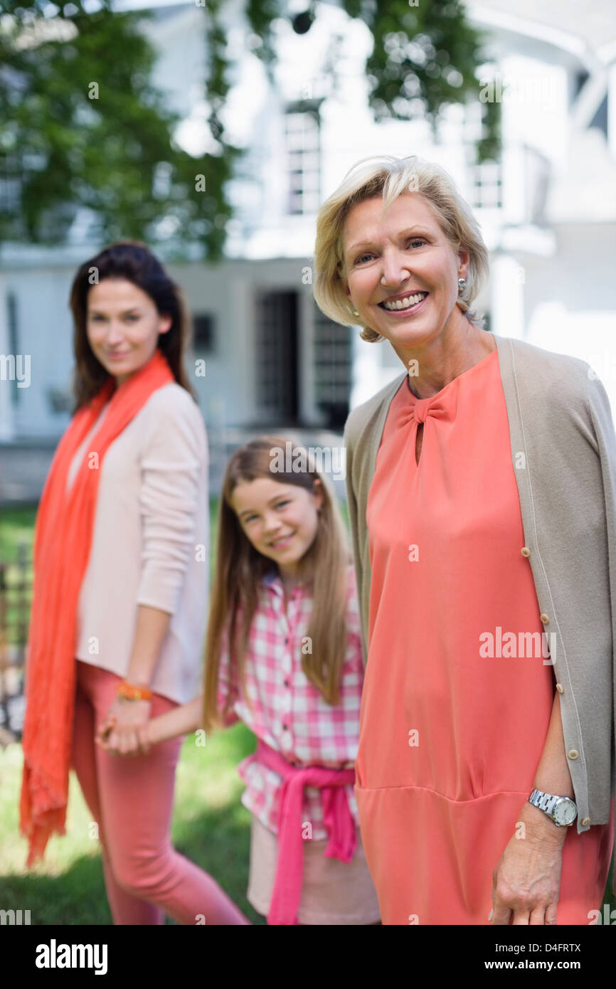 Three generations of women walking together Stock Photo
