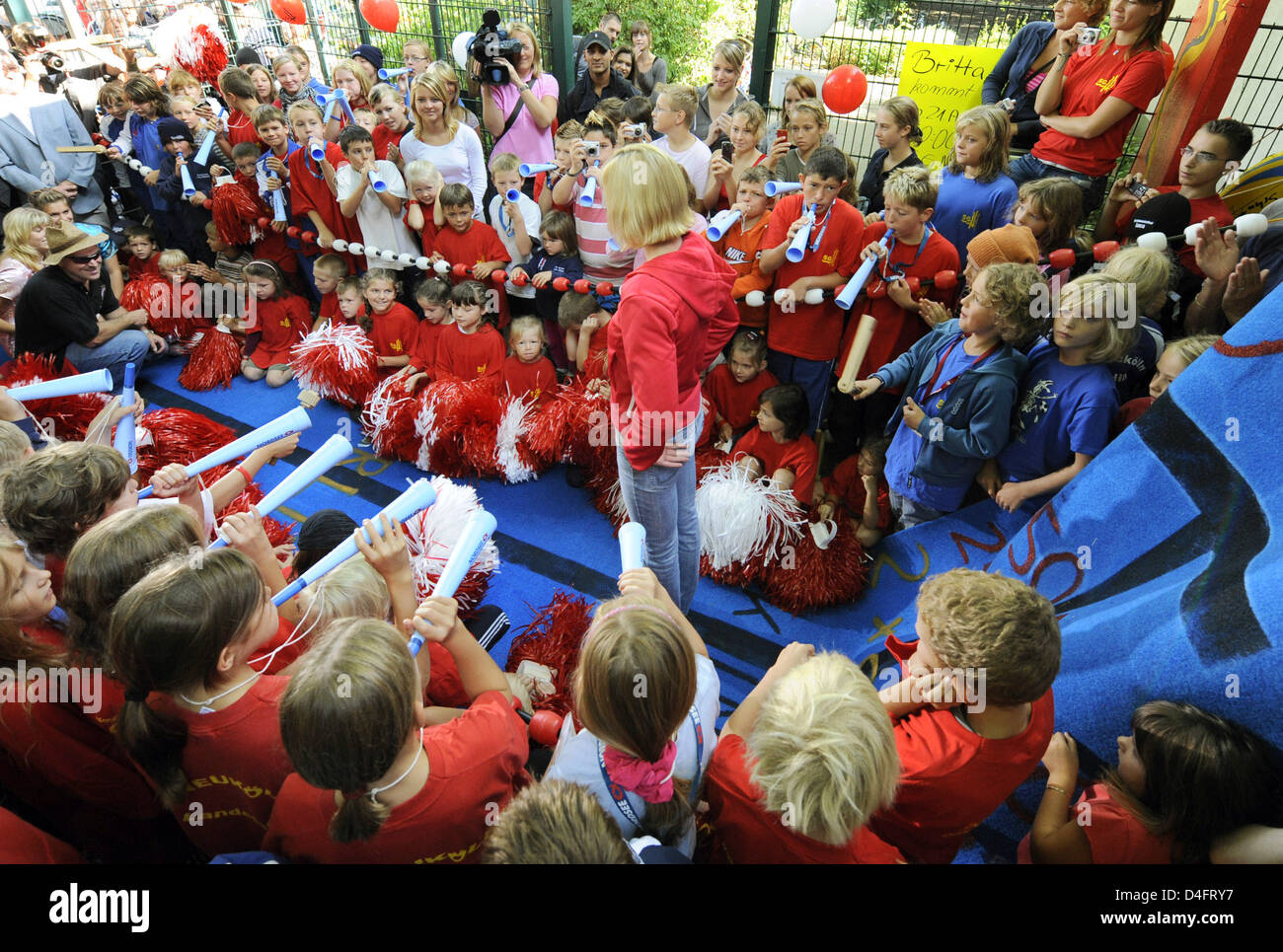 Children receive double Olympic gold medalist Britta Steffen (C) at her home club SG Neukoelln in Berlin, Germany, 21 August 2008. The club staged a festive reception for the 100m/50m freestyle Olympic champion. Photo: RAINER JENSEN Stock Photo