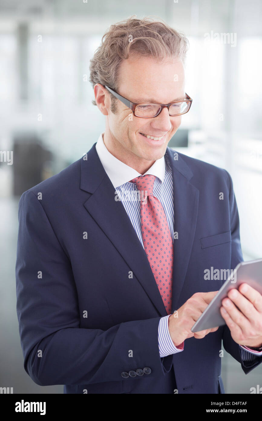 Businessman using digital tablet in office Stock Photo