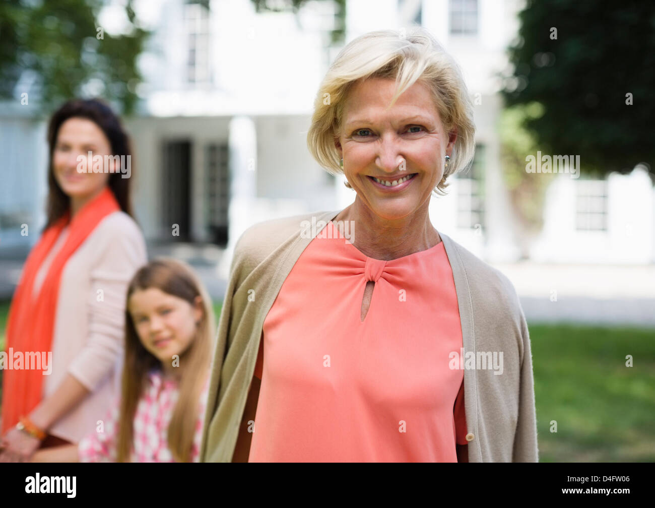 Three generations of women walking outdoors Stock Photo