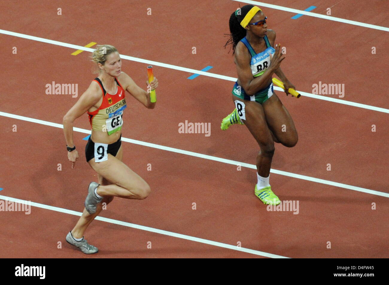 German Marion Wagner competes against Rosangela Santos of Brazil (R) in Women's 4 x 100m Relay Final during the Beijing 2008 Olympic Games in the National Stadium in Beijing, China, 22 August 2008. Photo: Bernd Thissen dpa ###dpa### Stock Photo