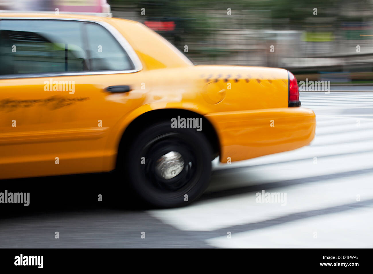 Blurred view of taxi on city street Stock Photo