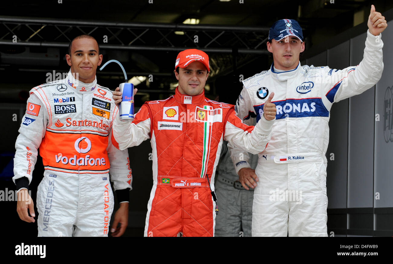 Brazilian Formula One driver Felipe Massa of Ferrari (C) poses with British F1 driver Lewis Hamilton of McLaren Mercedes (L) and Polish F1 driver Robert Kubica of BMW Sauber (R) after he clocked the fastest time in the Qualifying at Valencia Street Circuit in Valencia, Spain, 23 August 2008. The Formula One European Grand Prix will take place on Sunday, 24 August 2008. Photo: Carme Stock Photo