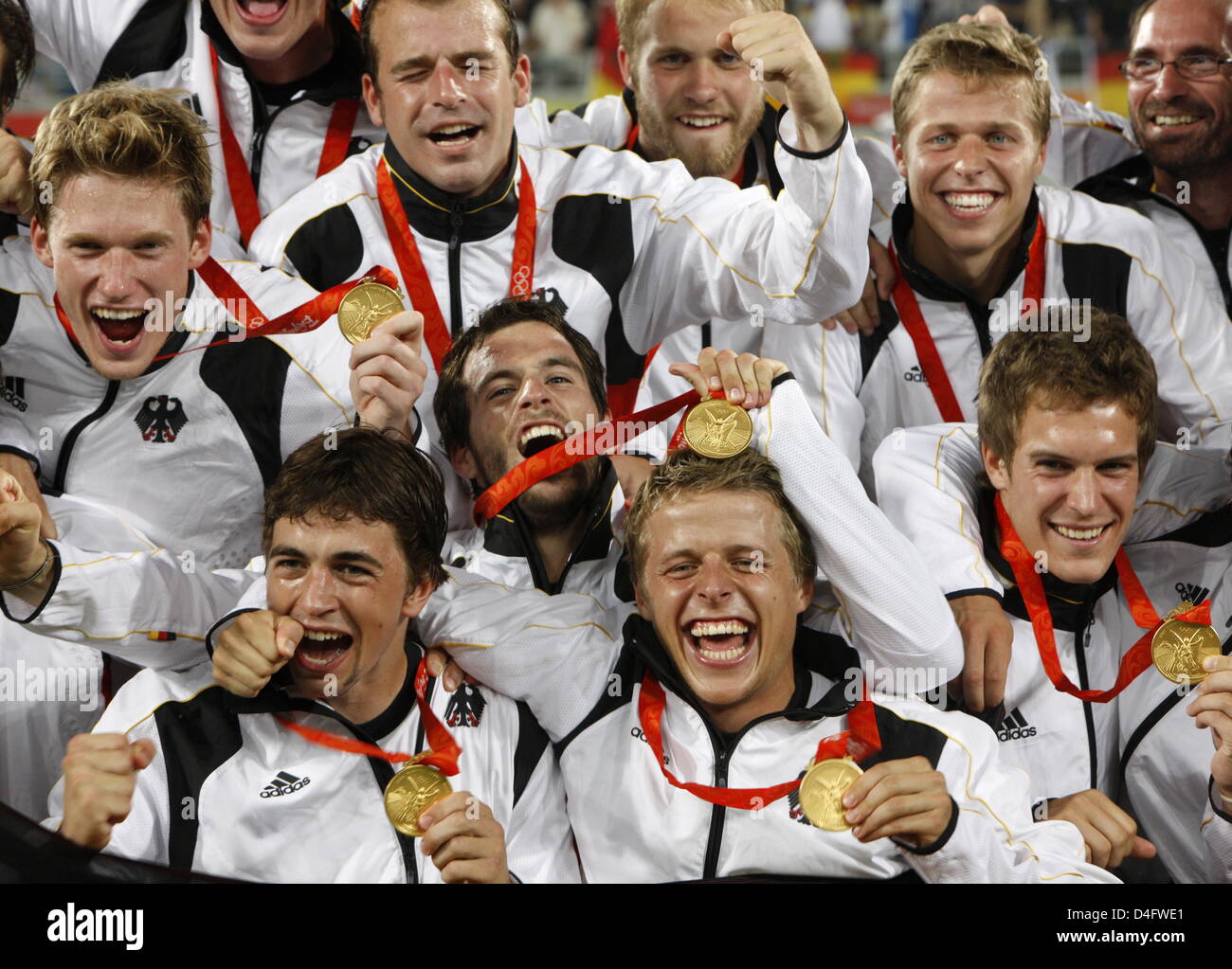 The team of Germany celebrate with their gold medals during the medal