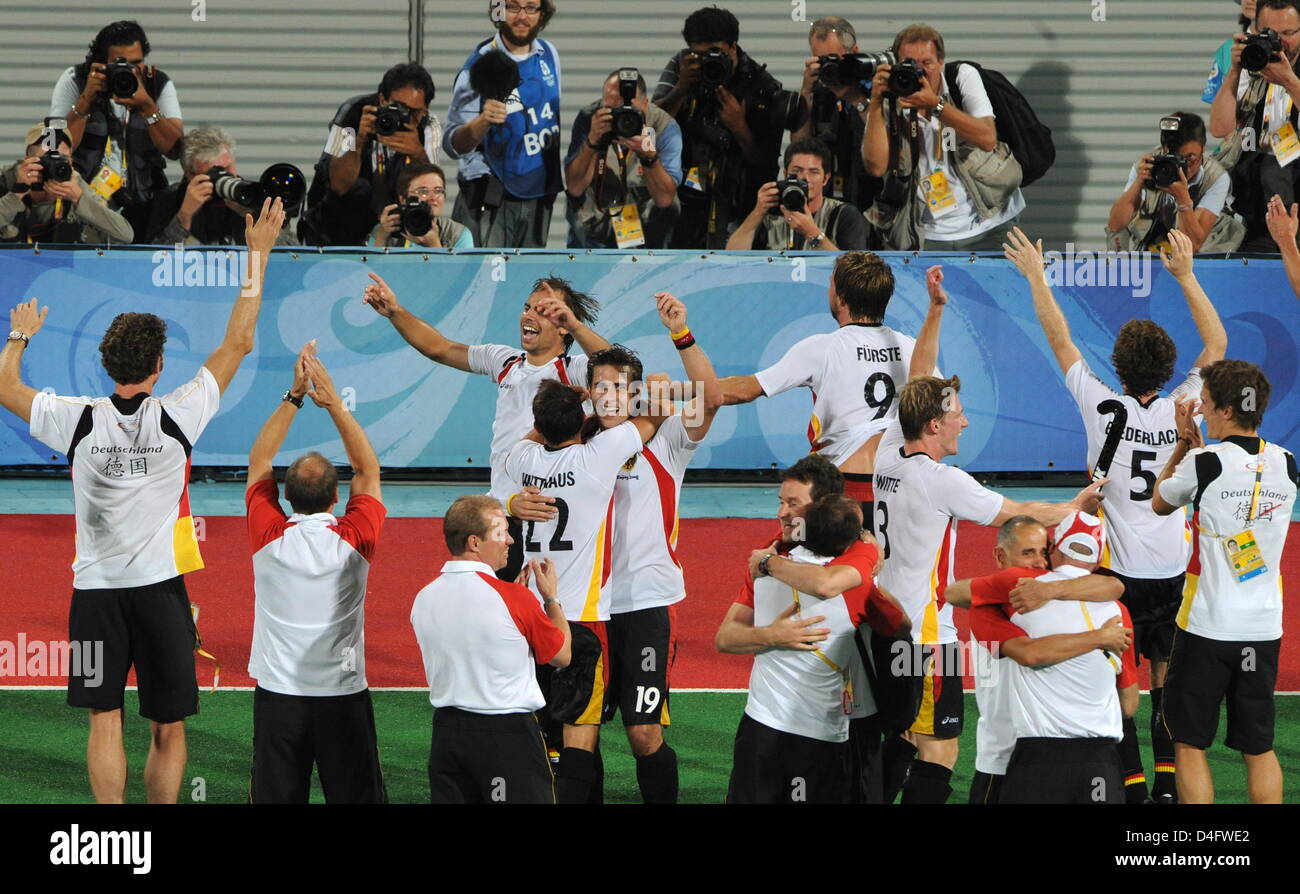 Players of Germany celebrate the win after the men's hockey final match