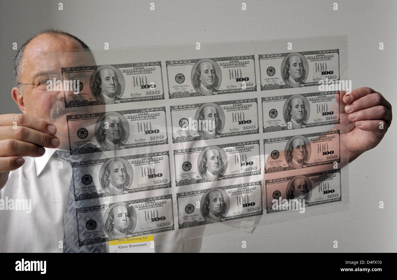 Department head for false money of the Federal Criminal Police Office, Klaus Braunwart, presents a transparent printing film at a press conference in Berlin, Germany, 27 August 2008. The latest strategies against organised crime were presented at the press conference. Photo: Soeren Stache Stock Photo