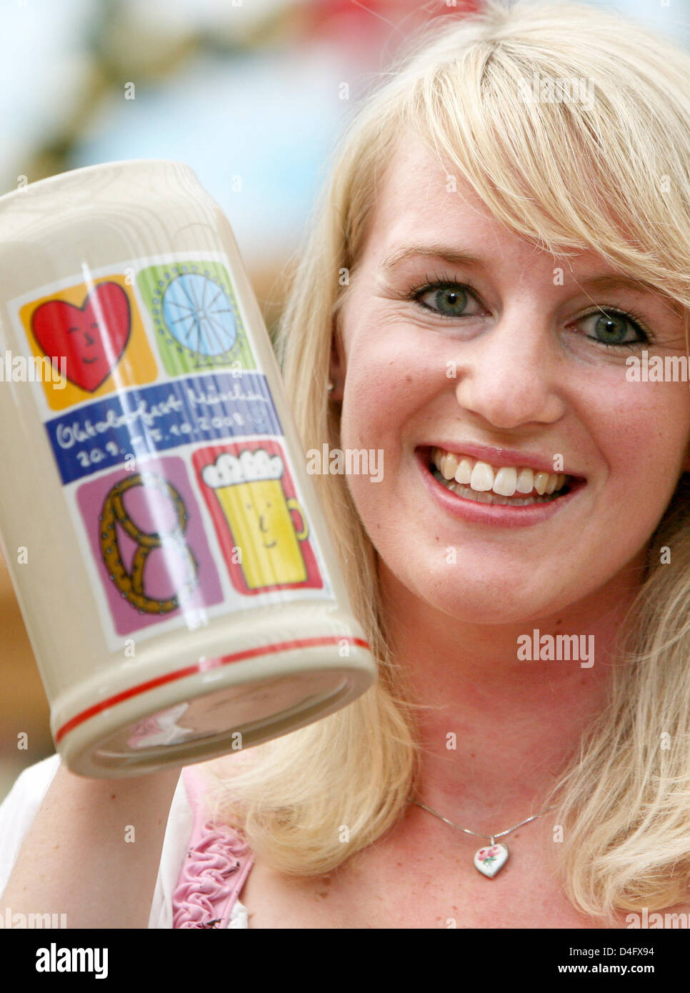 Assistant of the tourist office, Susanne Schneider, presents the official 'Wiesn-beer jug 2008' in Munich, Germany, 28 August 2008. The 175th Oktoberfest (Munich Beer Festival) will take place from 20 September till 5 Oktober 2008 in Munich. Photo: Tobias Hase Stock Photo