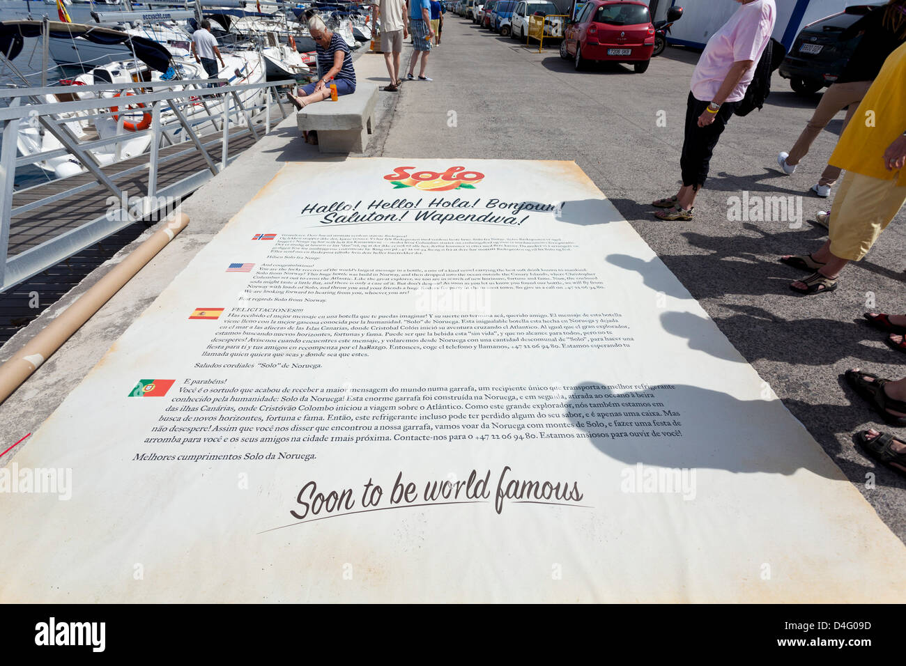 Tenerife. 13th March 2013. The 12m2 message which will go in the bottle at The official launch of world's biggest message in a bottle took place at San Miguel Marina. The launch ceremony conducted by Miss Tenerife Sur, Sady Chavez, and the Norwegian polar explorer Jarle Andhoy who ceremoniously broke a bottle of Solo soda pop to mark the occasion. The bottle will be towed out to sea and set adrift and whoever finds it as it comes ashore will be rewarded with a prize from the Solo soft drinks company. Stock Photo