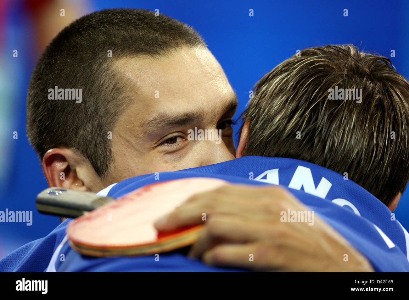 French table tennis player Christophe Durand (L) faces Korean EunChang