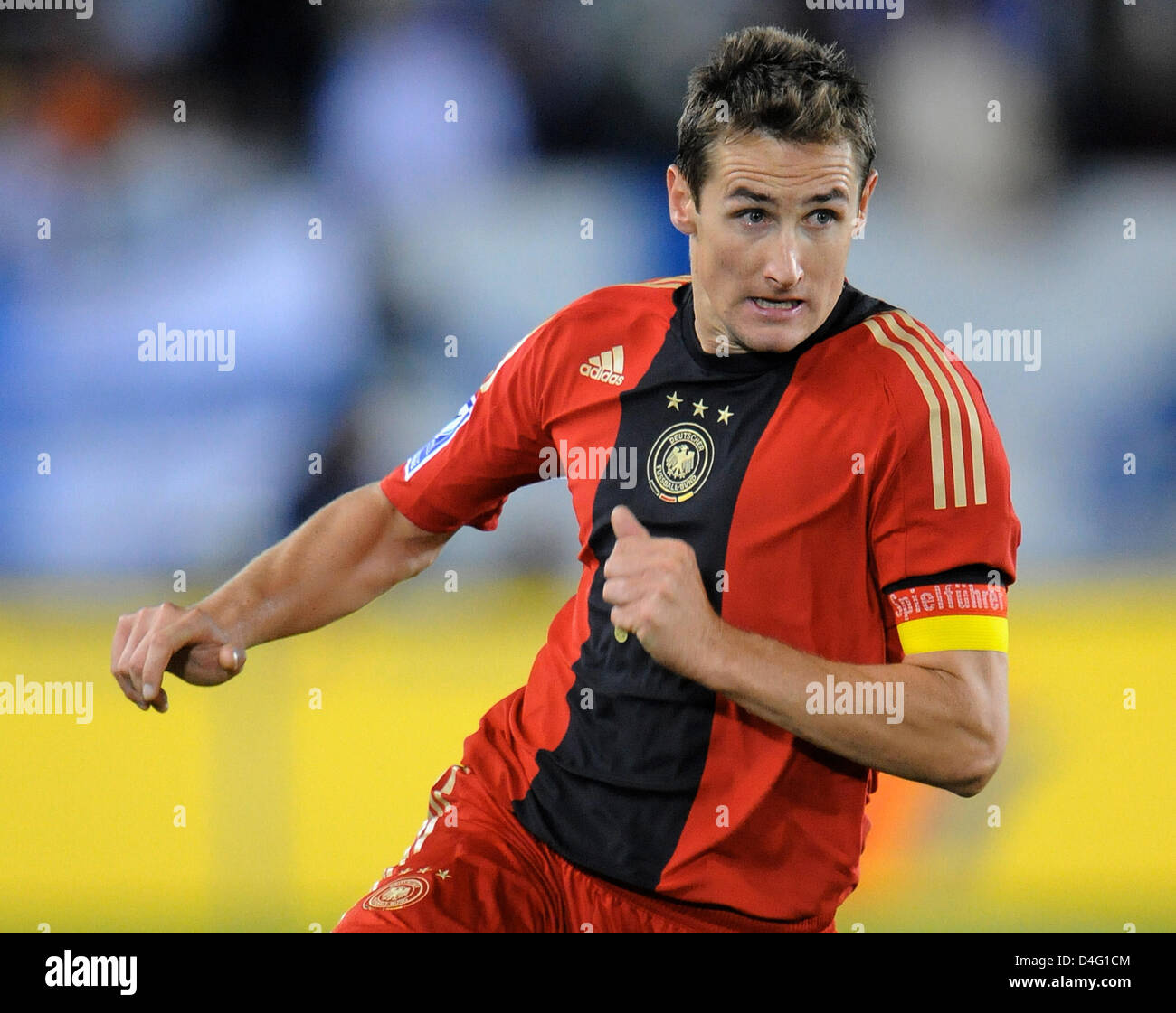 German team captain Miroslav Klose wears the captain's armband during the World Cup qualification match at the Olympic stadium in Helsinki, Finland, 10 September 2008. Photo: Ronald Wittek Stock Photo