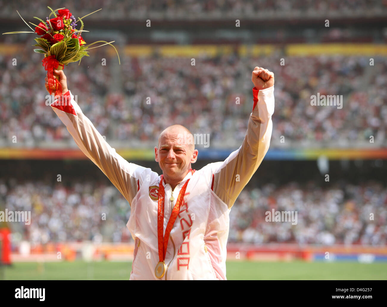 Canadian athelete Earle Connor celebrates winnign the 100m at the ...