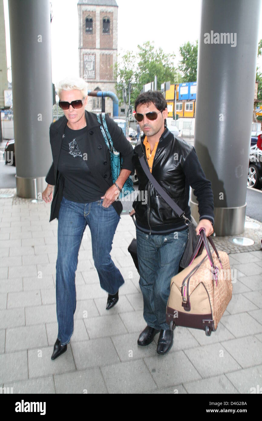 Danish actress Brigitte Nielsen and her husband Mattia Dessi arrive at Hotel Intercontinental in Cologne, Germany, 13 September 2008. Nielsen will be a guest of television show 'Guinness World Records - The biggest World Records'. Photo: Patrick Staubesand Stock Photo