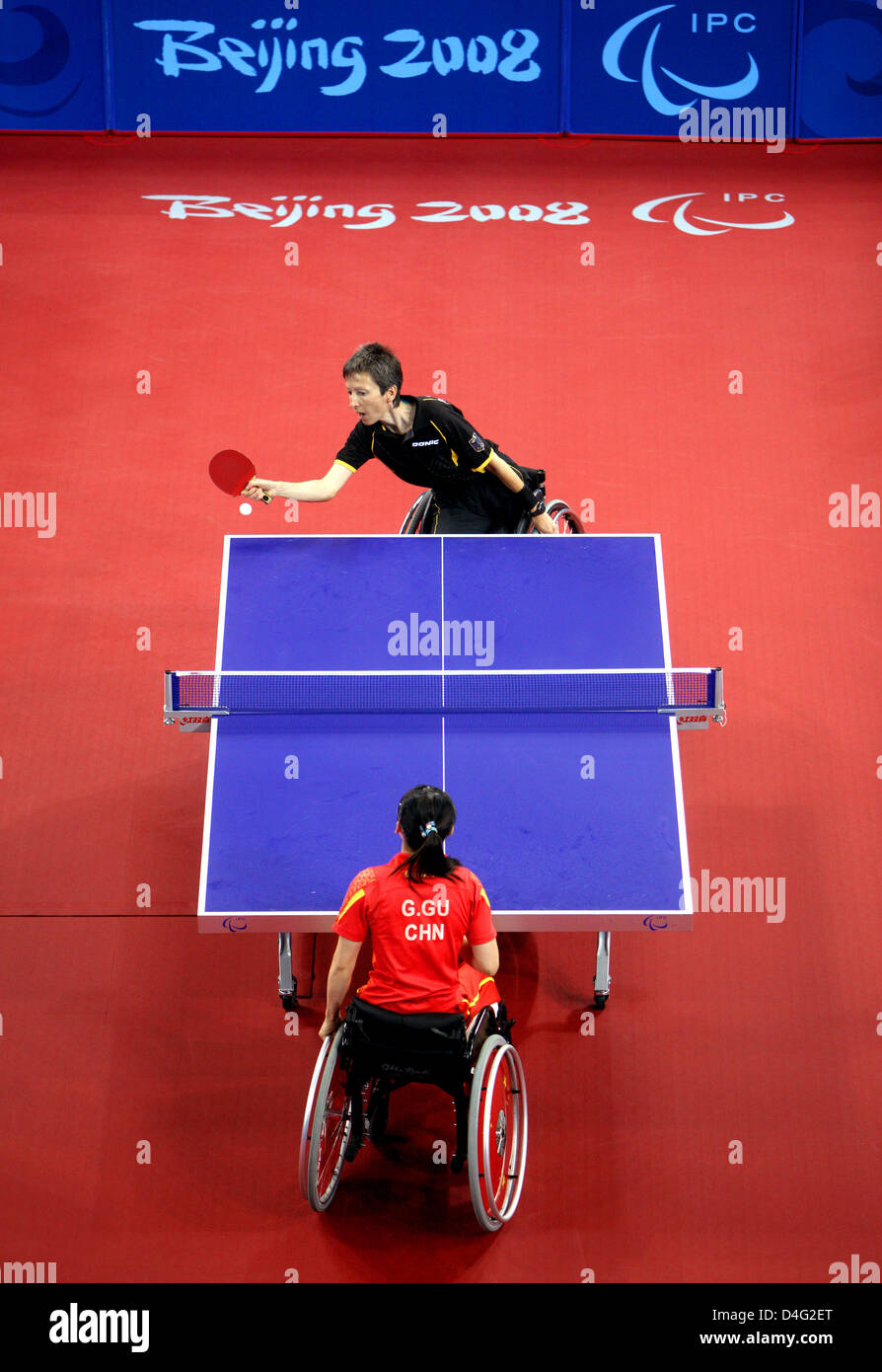 German table tennis player Andrea Zimmerer (top) defeats Chinese Gai Gu during the finals of the 13th Paralympic Games in Beijing, China, 16 September 2008. China won the gold medal. Photo: Rolf Vennenbernd Stock Photo